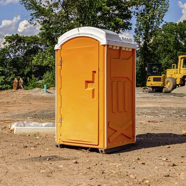 what is the cost difference between standard and deluxe portable toilet rentals in Highland